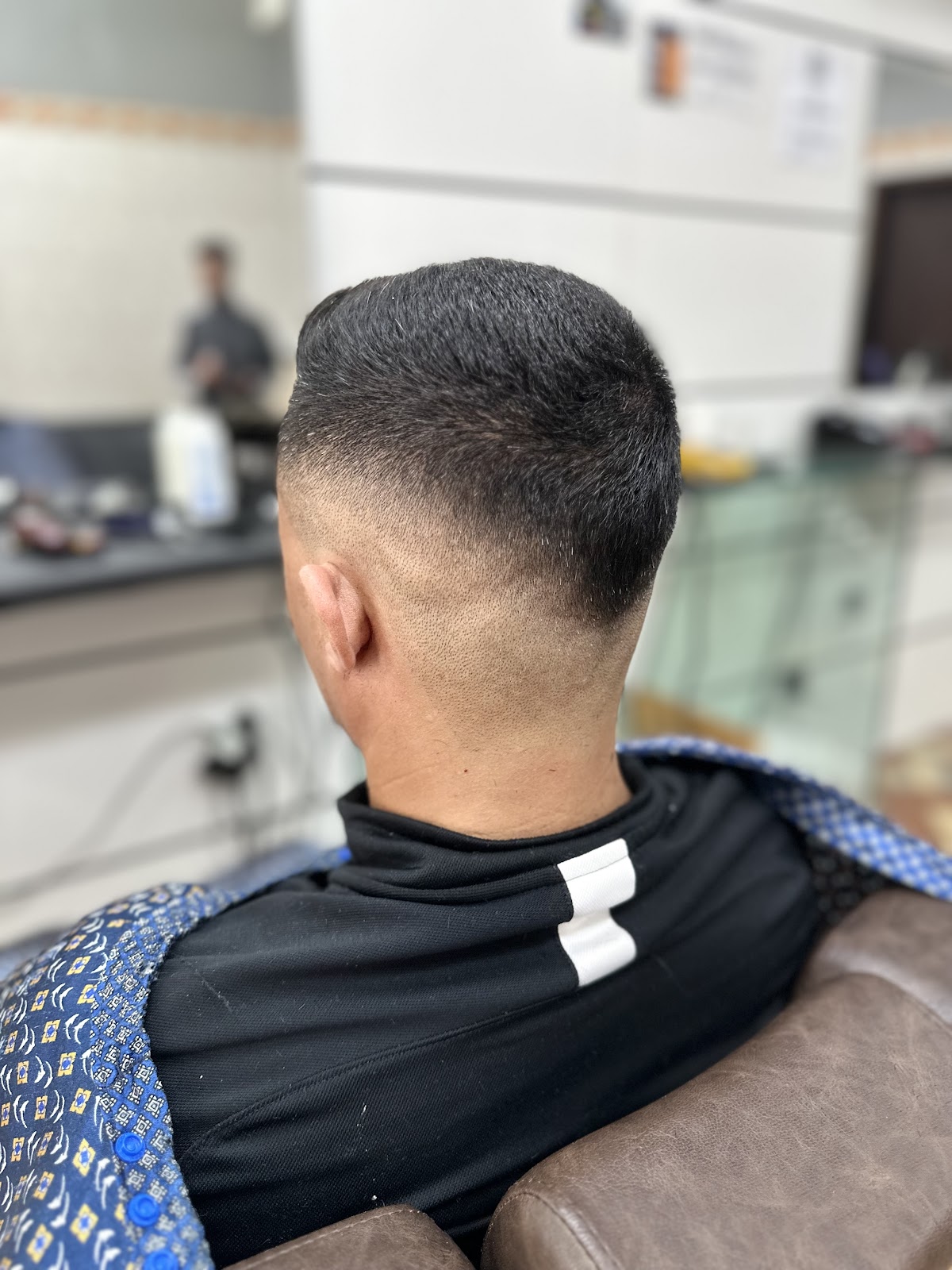 Fade bem acabado na nuca, feito na Barbearia André